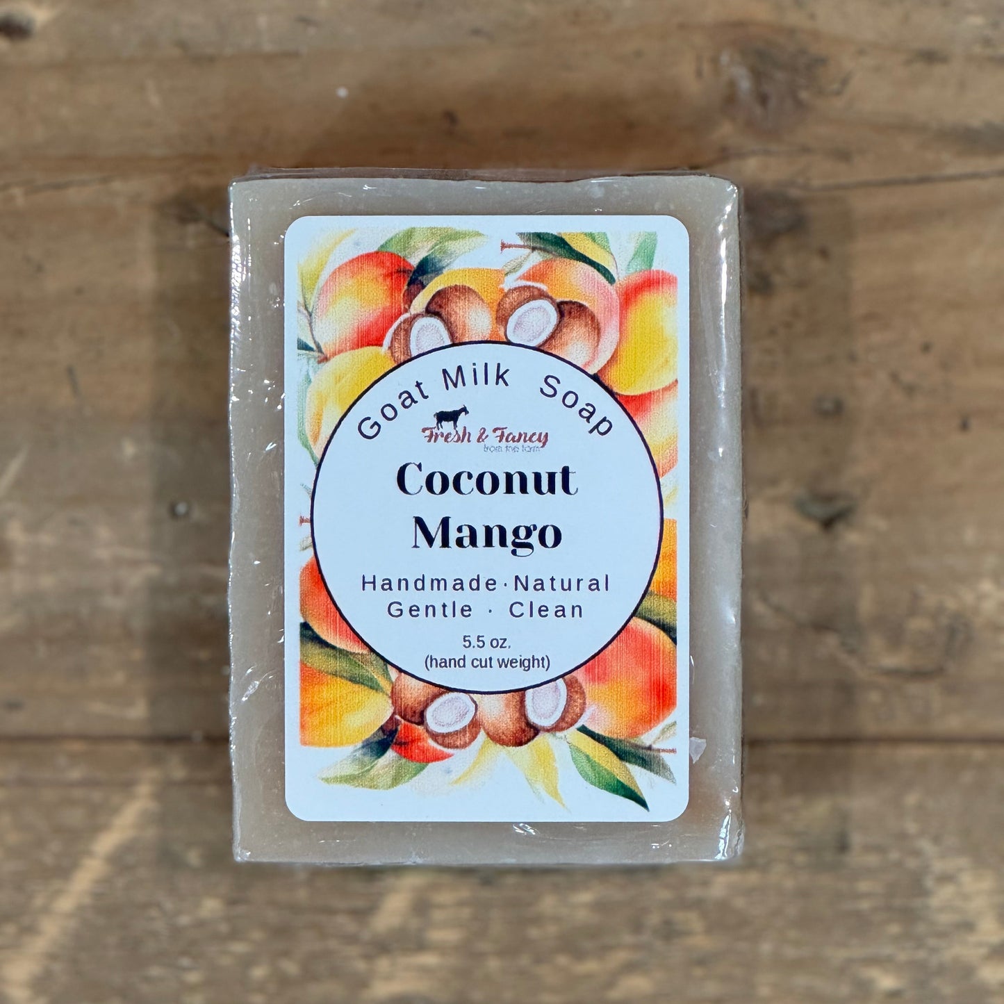 Natural color bar soap with coconut and mangos pictured on the label