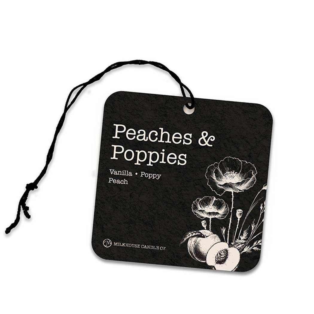 Black air freshener tag with 'Peaches & Poppies' design and branding on a white background