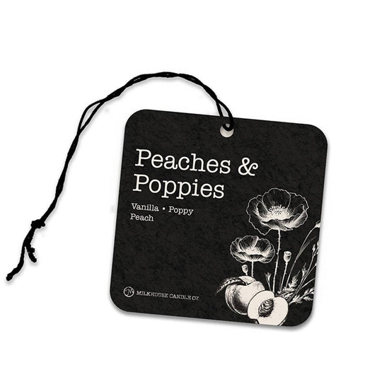Black air freshener tag with 'Peaches & Poppies' design and branding on a white background