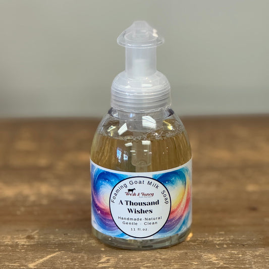 clear pump bottle with a multi colored labeled with stars throughout