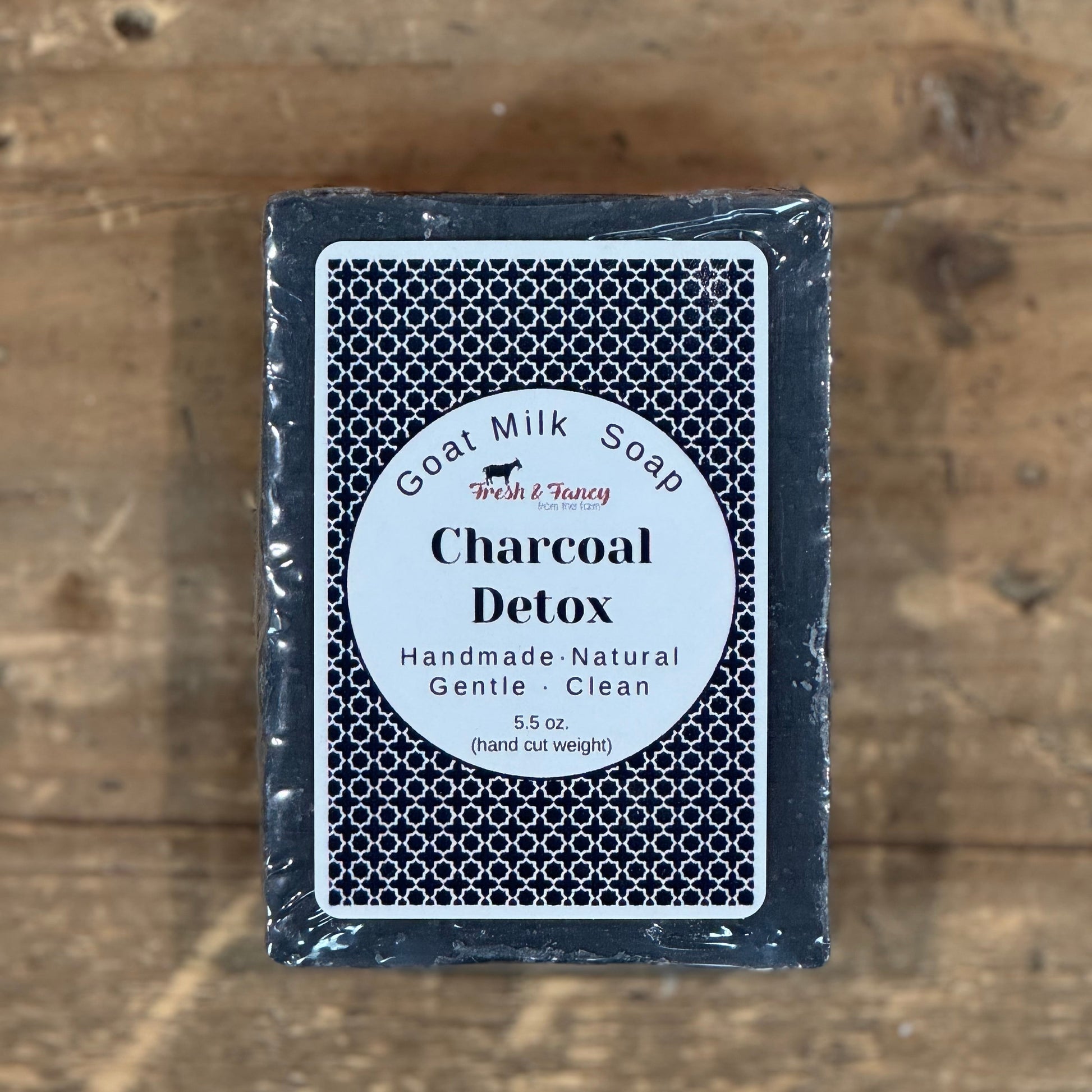 Black colored bar soap with a black and white label