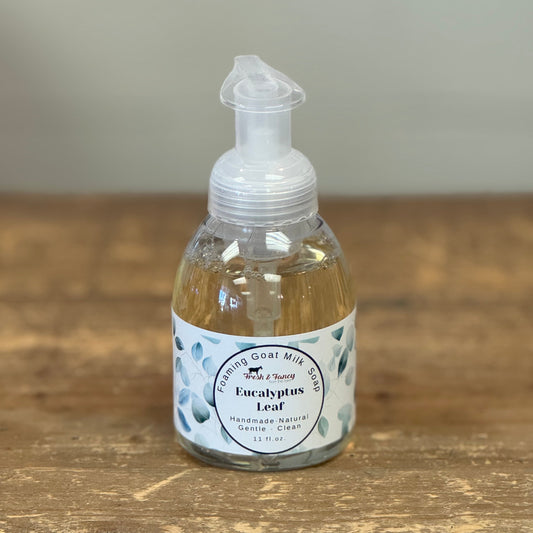 Clear pump bottle. White label with light green eucalyptus leaves