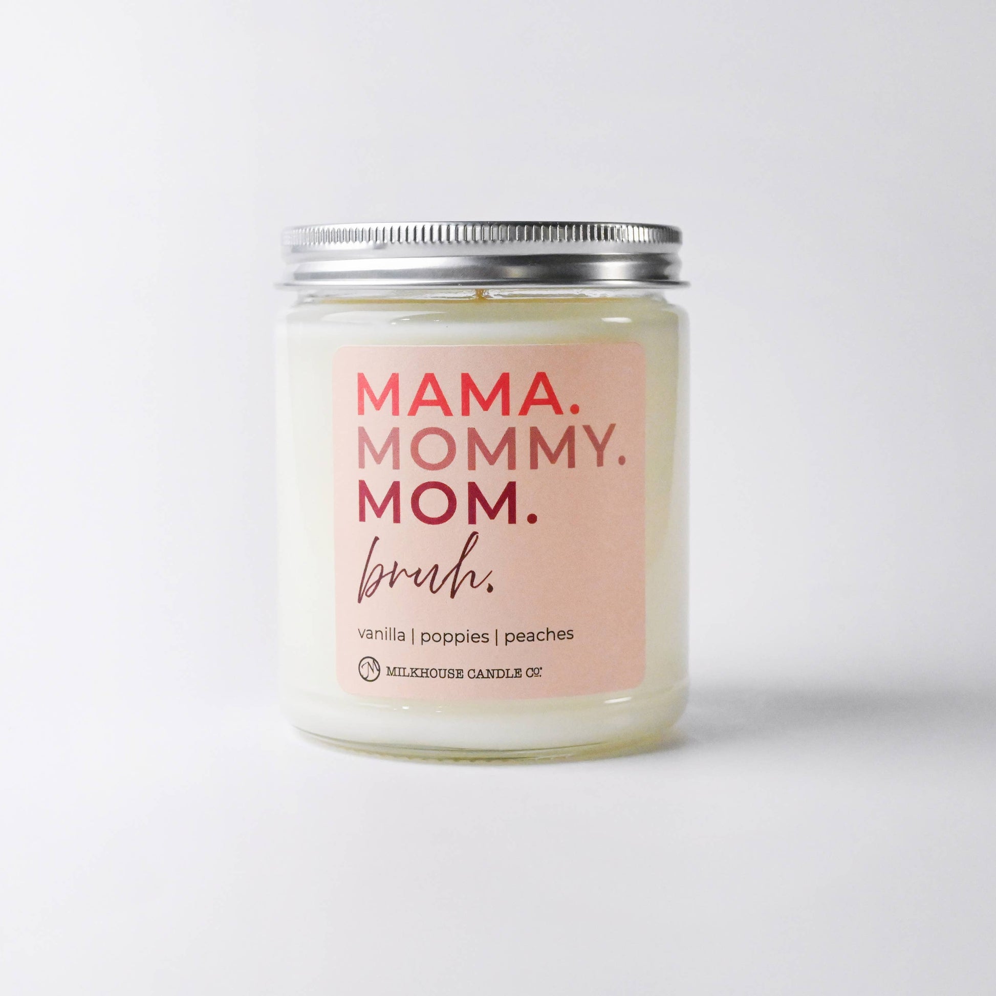 Candle with 'MAMA. MOMMY. MOM.' text on a white background