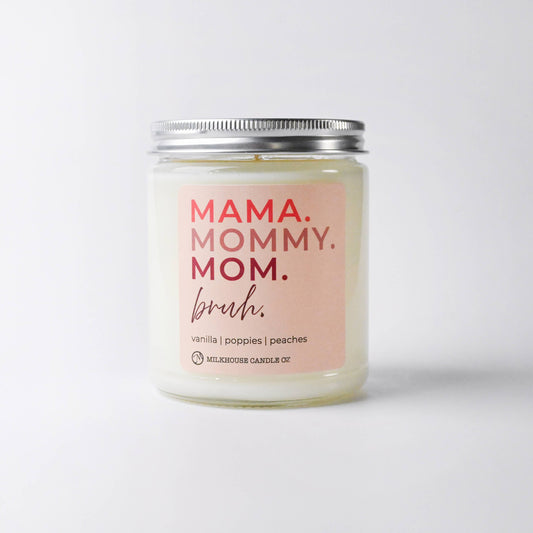 Candle with 'MAMA. MOMMY. MOM.' text on a white background