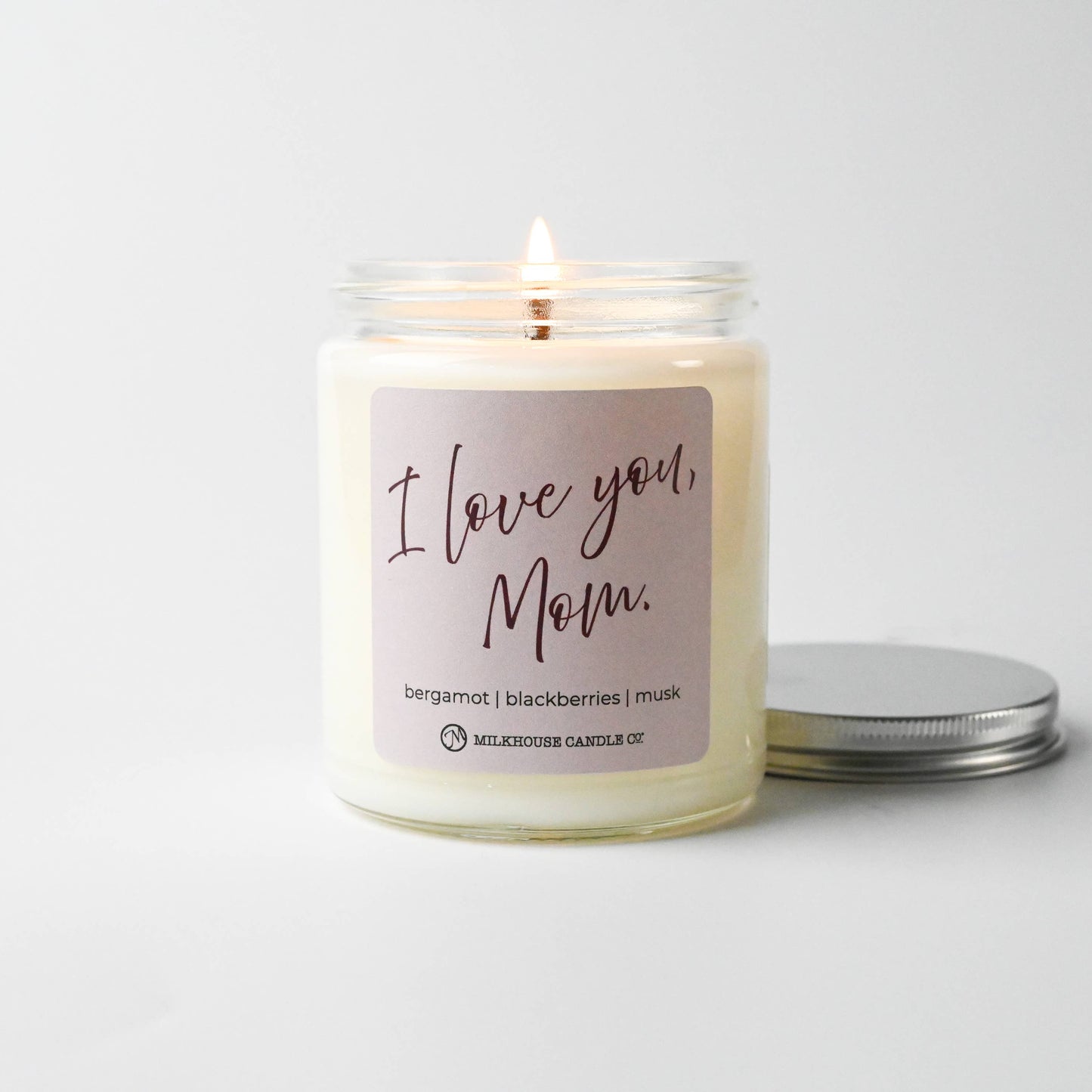 Candle with 'I Love You, Mom' label on a white background