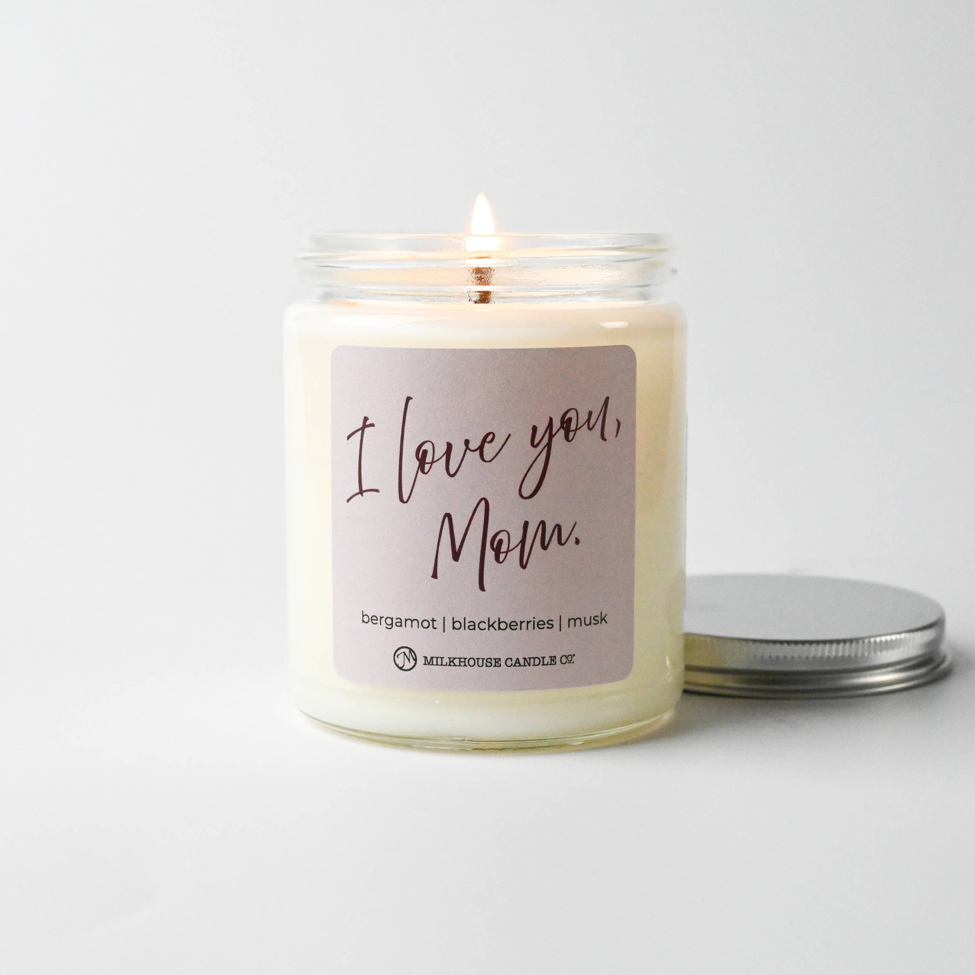 Candle with 'I Love You, Mom' label on a white background